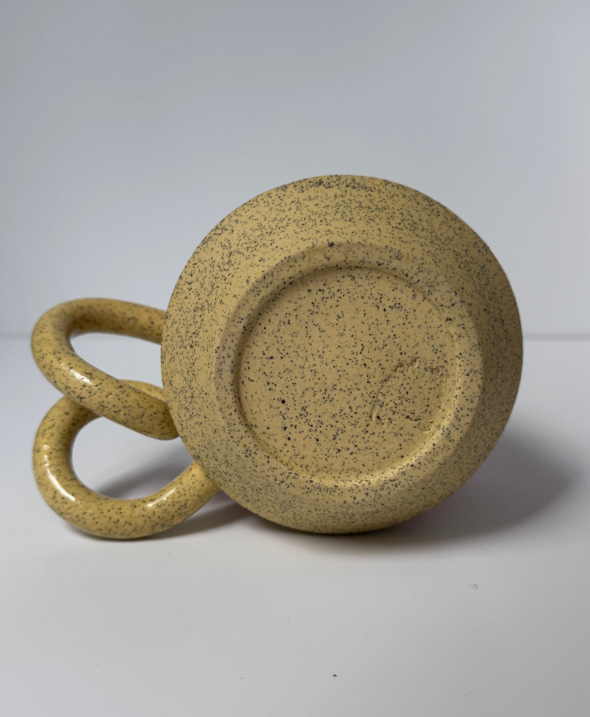 ‘Pink lemonade’ drippy glaze mug on yellow speckled porcelain