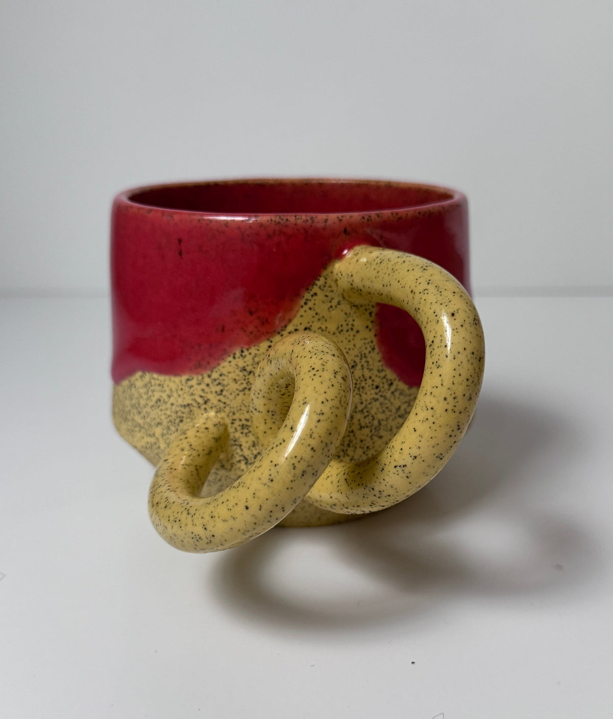 ‘Pink lemonade’ drippy glaze mug on yellow speckled porcelain