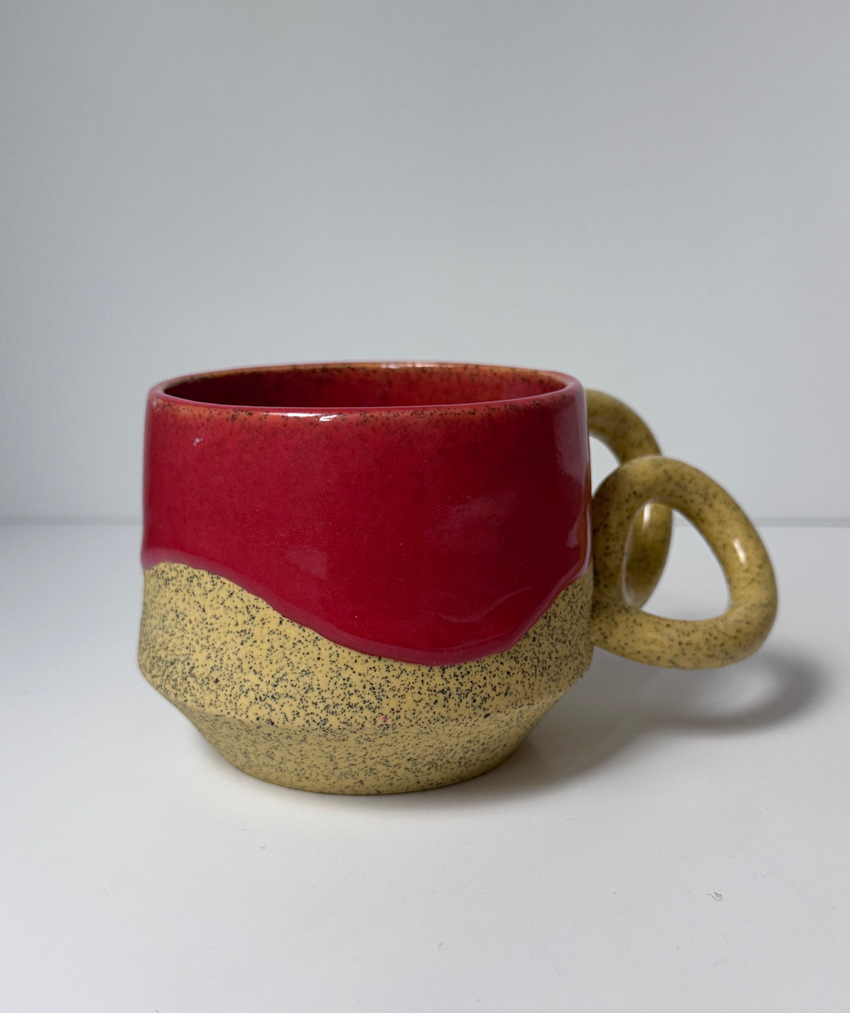 ‘Pink lemonade’ drippy glaze mug on yellow speckled porcelain
